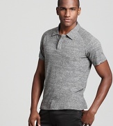 A charcoal gray cotton polo from Theory gets downtown-inspired styling with hidden front buttons and a slim fit.