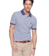 Classic simplicity in a modern cut. This slim-fit polo shirt from Izod will easily become a mainstay in your wardrobe. (Clearance)