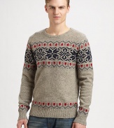 A soft, sumptuous wool blend is knitted in a playful and colorful Fair Isle pattern for traditional seasonal style.CrewneckRibbed knit collar, cuffs and hem80% wool/20% nylonDry cleanImported