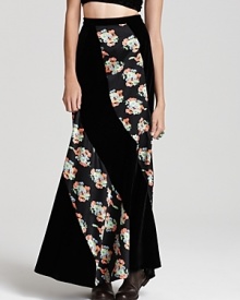 Plush velvet and fresh florals meet for '70s-inspired style on this Free People maxi skirt. Work the floor-sweeping look in romantic fashion--think tall leather boots and a sheer crochet sweater.