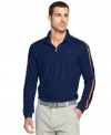 Pipe in comfort and style onto the golf course with this Puma shirt featuring moisture-management technology.