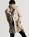 An undisputed classic from Burberry, the double-breasted trench coat brings understated style to blustery days.