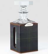 Encased in a plaid saddle leather sleeve, a gleaming lead crystal decanter with a rotating stainless-steel nameplate engraved with a selection of spirits: Vodka, Whiskey, Rum, Scotch or Gin.26 ounces3¾L x 9H x 3¾DHand washImported