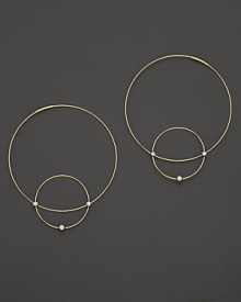 Like magic, smaller hoops balance on 14K gold counterparts.