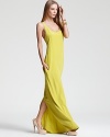 An electric neon hue lights up the room and all eyes are on you in this BCBGMAXAZRIA maxi dress. Elegantly skimming your silhouette, the lengthy style features a high slit at the back.