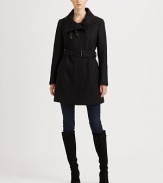 Featuring striking seams, leather tab details and classic ribbed-knit trim, this coat made from an Italian virgin wool blend is a must-wear.Leather tabs on collarConcealed zipper closureBelted silhouettePatch pocketsRibbed-knit trimFully linedAbout 33 from shoulder to hem80% virgin wool/20% nylonDry clean by leather specialistImported of Italian fabric Model shown is 5'11 (180cm) wearing US size 2. 