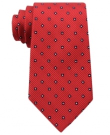 A bold pattern make this Tommy Hilfiger silk tie pop for a look that's sure to get you noticed.