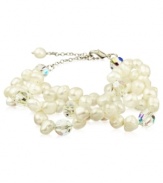 Go for a subtle hint of shimmer, or a standout look. This beautiful bracelet highlights cultured freshwater pearls and sparkling Swarovski crystal accents. Set in sterling silver. Approximate length: 6-1/4 inches + 2-inch extender.