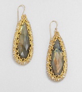 From the Elements Siyabona Collection. The tantalizing iridescence of faceted labradorite teardrops, elegantly framed by a spikey golden setting accented with Swarovski crystals.LabradoriteCrystalGoldtoneDrop, about 2.25Ear wireMade in USA