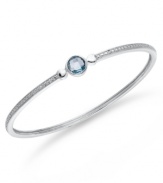 Bangle love. You'll adore Victoria Townsend's stunning sterling silver bangle with its pretty round-cut blue topaz (1-1/2 ct. t.w.) and sparkling diamond accents. Approximate circumference: 8 inches.