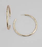 Simple hoops become simply sensational when crafted with a rich hammered texture. 18k yellow gold Diameter, about 2 Post back Imported