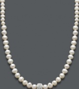 Shimmer and shine. Cultured freshwater pearls (6-8 mm) and a sparkling crystal-accented ball make for an elegant combination on this stunning strand necklace. Approximate length: 18 inches.