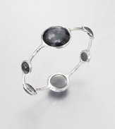 From the Wonderland Collection. Round faceted hematite doublet stations in various sizes set on a hammered sterling silver bangle. Hematite doubletSterling silverDiameter, about 2.5Slip-on styleImported 