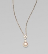 Five dazzling diamonds accent this round Akoya pearl pendant on a sleek 18k white gold link chain. 8MM white, round, Akoya pearlDiamonds, .35 tcwLength, about 18Pendant size, about 1¾ Lobster clasp closureImported 