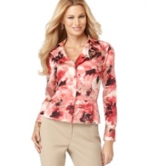 Featuring a feminine floral print and pretty ruffled neckline, this Jones New York Signature shirt adds instant elegance to your look.