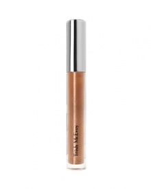 Trish's eye-catching Irresistible Lip Gloss Nude Shimmer is lightly flecked with alluring points of light for a mirror effect that creates the illusion of fuller lips and instantly glamorizes any look. Just one stroke of the comfortable long-wear formula releases high shine and soft shimmering color for a radiant finish in the sexiest shade of resplendent nude.