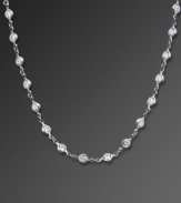 Crafted in platinum over sterling silver and embellished with sparkling cubic zirconias (13 ct. t.w.), CRISLU's long necklace is both timeless and versatile. Approximate length: 18 inches.