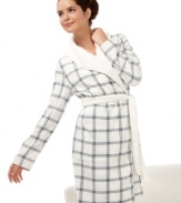 Coziness is calling. Relish the soft fleece and faux shearling trim of the short River robe by Nautica. An understated plaid sweetens the style.