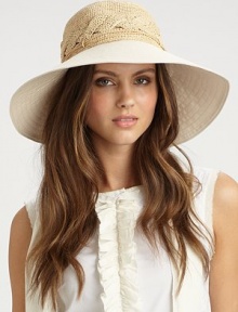 A mixed-media style with crocheted raffia in a cabled design and a canvas brim; the perfect packable hat. RaffiaCottonBrim, about 3Elastic inner bandSpot cleanImported 