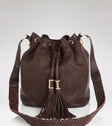 Rachel Zoe channels a vintage vibe with this slouchy, drawstring shoulder bag. In raffia and leather, it's a hippie-chic way to work this season's textured trend.