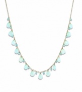 Like brilliant blue skies, this collection of apatite (3 mm) and chalcedony (7 mm) gemstones creates a breathtaking view across this shapely necklace. Gems are set in 14k gold. Approximate length: 16 inches.