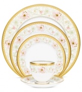 East meets West in the ornate Blooming Splendor place setting by Noritake. A Japanese-inspired pattern with raised dots encircles intricate florals rooted in white bone china.