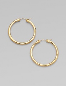 From the Martellato Collection. Graceful hoops with a rich hammered texture in gleaming 18k gold.18k yellow goldDiameter, about 1¾PiercedMade in Italy