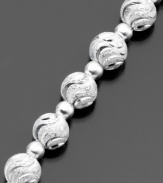 This distinctive bracelet features beautifully swirled beads (6 mm) of luminous diamond-cut sterling silver by Giani Bernini. Approximate length: 7-1/2 inches.