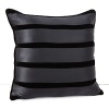 Alternating bands of caviar colored satin and velvet reverses to solid satin on this decorative pillow.