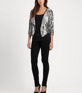 Embrace the wow factor in this cropped sequin blazer with dolman sleeves and a contour hem. Oversized shawl collarThree-quarter dolman sleevesContoured cropped back hemAbout 23 from shoulder to hemViscoseDry cleanImportedModel shown is 5'9 (176cm) wearing US size Small.