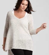 A longer length and relaxed silhouette distinguishes this Eileen Fisher tunic sweater as an off-duty wardrobe staple.