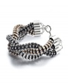 Triple threat. Bar III's chic braided bracelet creates a statement all its own with sparkling clear and hematite crystals and a clever tri-tone design. Crafted in burnished silver, gold, and hematite tone mixed metal. Approximate length: 7 inches + 1-inch extender.