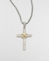 A cross of luminous pavé diamonds, accented with 18k yellow gold, hangs from a sterling silver chain.Diamond, 0.25 tcw 18k yellow gold Sterling silver Pendant length, about ¾ Chain length, about 16-17 Lobster clasp Imported