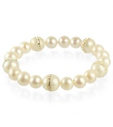 Elegance defined. This pretty stretch bracelet combines cultured freshwater pearls (8-10 mm) and cubic zirconia accents in a polished 18k gold over sterling silver setting. Approximate length: 7-1/2 inches.