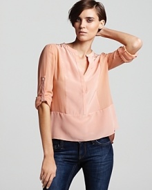 A soft-hued BCBGMAXAZRIA silk top elevates your every day styles with easy chic. Seam detail and a high/low hem shape the silhouette for a polished finish.