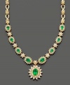 Establish everlasting elegance with this royalty-inspired necklace by Effy Collection. Filled with lovely detail, this necklace features oval and round-cut emeralds (3-3/8 ct. t.w.) and round-cut diamonds (2-1/3 ct. t.w.) set in 14k gold. Approximate length: 16 inches. Approximate drop: 1 inch.