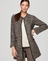 Classic tweed gets a contemporary spin as metallic threading modernizes this Bloomingdale's exclusive Gerard Darel coat. Garnish with gold accents for shameless spotlight appeal.