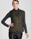 Flaunt sporty style with this quilted Barbour vest with cozy fleece lining.