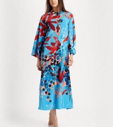 A bold abstract print covers this long silhouette, perfect for layering with your favorite pieces. Pull-over styleMandarin collarLong sleevesAbout 52 from shoulder to hemPolyesterMachine washImported