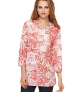 An allover paisley print creates a colorful impact on this tunic from J Jones New York. Rhinestones at the neckline add a little sparkle, too!