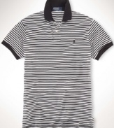 A classic-fitting short-sleeved polo shirt is crafted from breathable cotton mesh with a sleek striped pattern for casual polish.