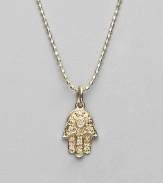 The open hand, a traditional symbol of protection, set with pavé diamonds and a diamond center on a 14k yellow gold ball chain. Diamonds, 0.05 tcw 14k yellow gold Chain length, about 16 Pendant, about ½L x ¼W Lobster clasp Imported