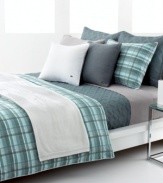 The Odum duvet cover set from Lacoste features an effortless plaid pattern in a mixture of moss green and smoky blue over ultra-comfortable cotton. Subtle lines of light rust run through the casual look, offering a coordinate with textured Lacoste bedding accents.