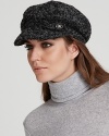 Nubby boucle lends a cozy feel to this stylish cap from August Accessories.