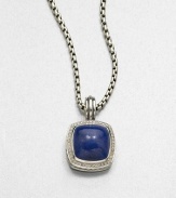 From the Albion Collection. A lapis cabochon set in sterling silver accented with brilliant diamonds on a bale. LapisDiamonds, .48 tcwSterling silverSize, about .66ImportedPlease note: Chain sold separately. 