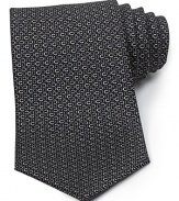 A luxurious piece that lies at the center of your dress wardrobe, this handsome tie from Salvatore Ferragamo is crafted in 100% Italian silk.