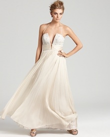 A rhinestone-embellished bodice lends major glamour to this sweeping ABS by Allen Schwartz strapless gown.