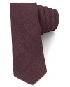 A melange of materials creates subtle tonal shifts on this tie from Theory, skinny in width for your modern attire.