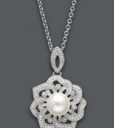 Natural inspiration. This stunning open-cut flower pendant features a single cultured freshwater pearl (8-9 mm) surrounded by round-cut diamond encrusted petals (1/5 ct. t.w.). Setting and chain crafted in sterling silver. Approximate length: 18 inches. Approximate drop: 1-1/4 inches.