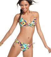 Punch up your seaside look with a bright ikat print bikini top from Raisins. The bold pattern is sure to make waves!